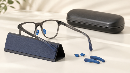 Eyeglasses with nose pads and temple grips for a secure fit