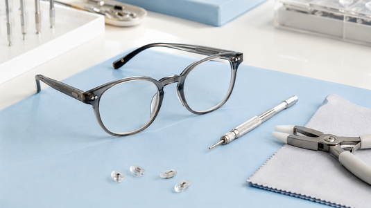 Eyeglass frame with professional optical adjustment tools
